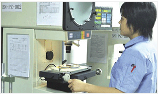 Workers operating in the production of parts of the equipment