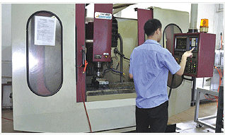 Workers operating in the production of CNC airsoft parts of the equipment